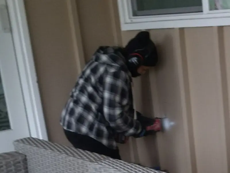 Professional electrician installing an exterior outlet in Frederick