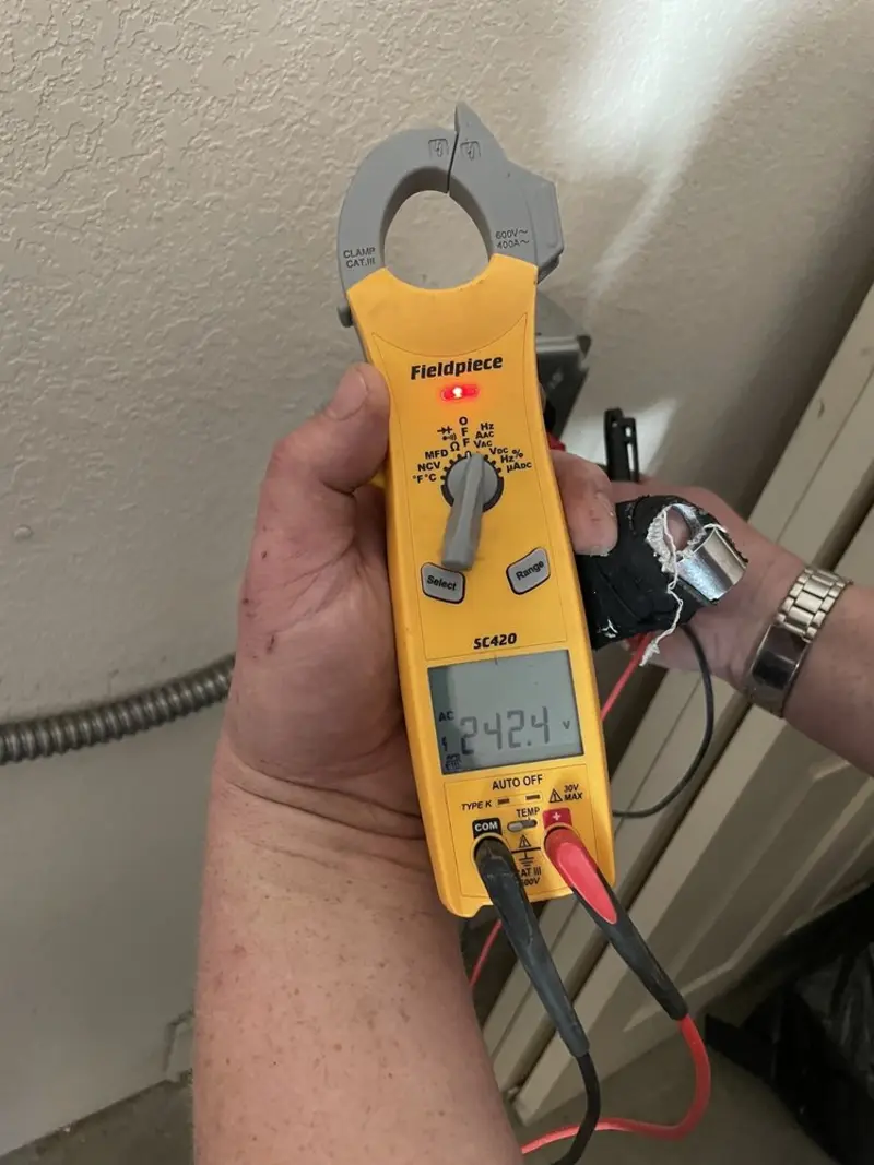 Voltage testing with clamp meter during Ceiling Fan Installation in Frederick